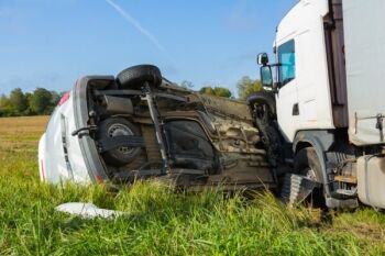 Truck and car collision indicating the need for a trucking accident investigation.