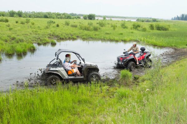 Shows two ATV - UTV vehicles possibly about to crash which end in Kentucky ATV and UTV passenger injuries.