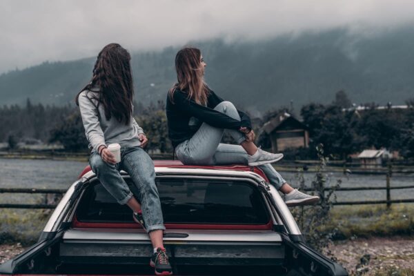 Teen Drivers Sitting on Car