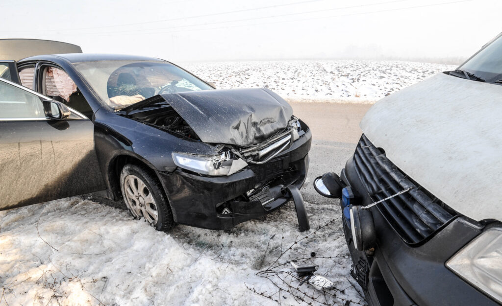 Winter vehicle accident on snowy Kentucky road - Personal injury attorneys Saladino & Schaaf can help.