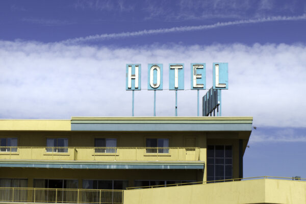 Old fashioned hotel with sign - guests might be injured on premises - Call personal injury attorneys Saladino and Schaaf